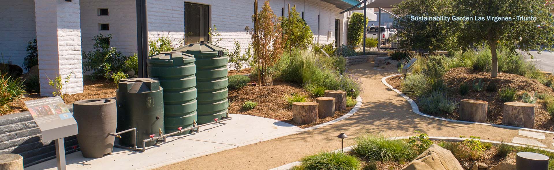 Sustainability Garden Las - Virgenes Triunfo with rain barrels and native plants in background